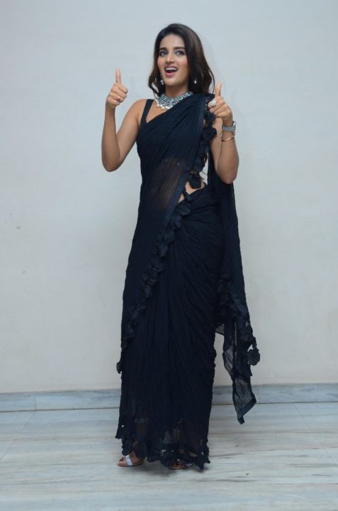 Nidhhi Agerwal in black saree at Ismart Shankar Pre-Release Event