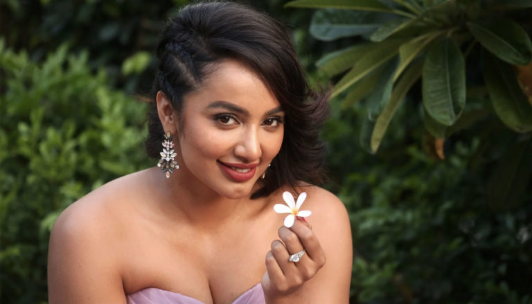Tejaswi Madivada stills wearing strapless purple gown