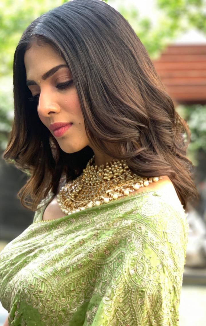 Malavika Mohanan Green Saree Stills At Thalapathy Pooja