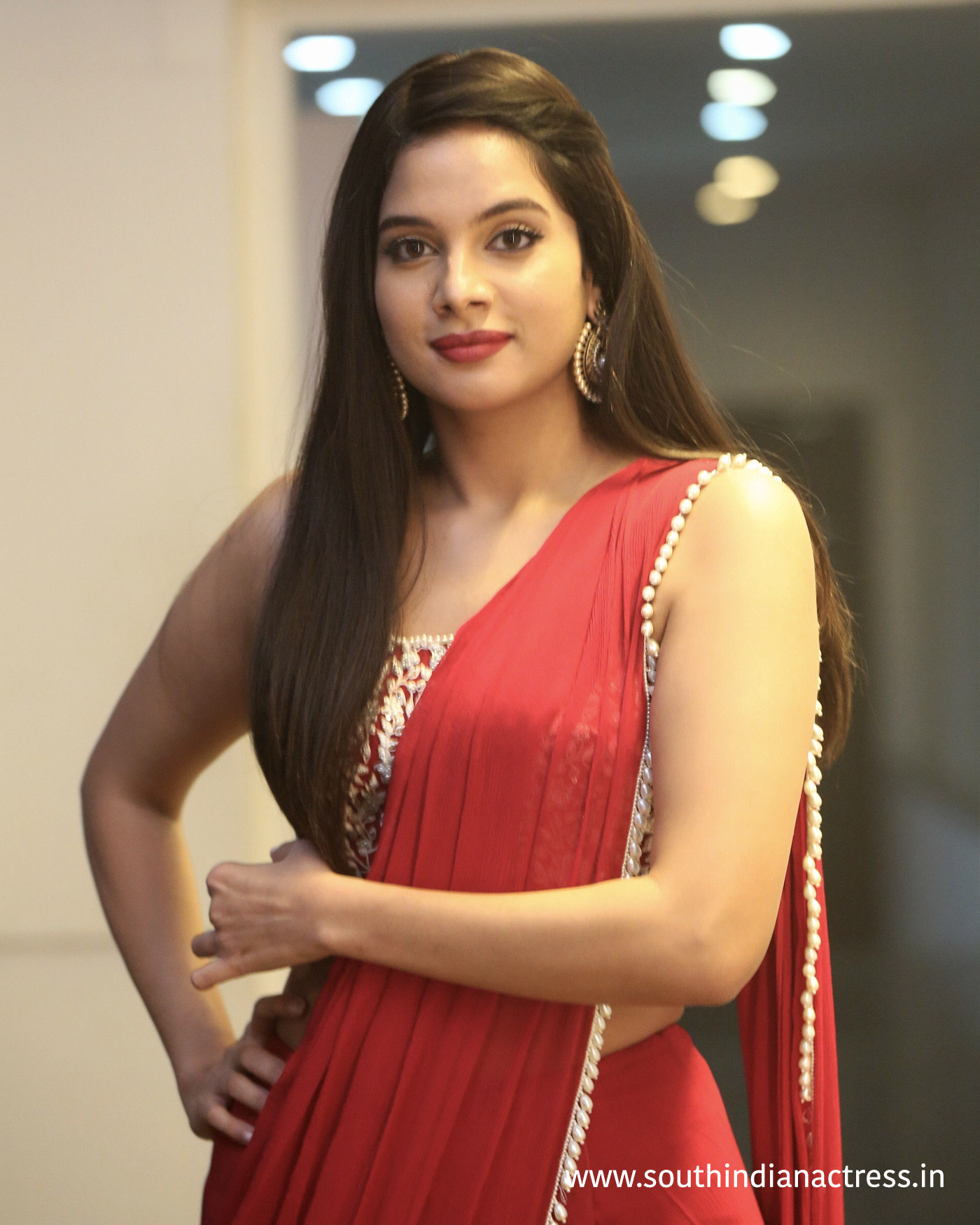 Tanya Hope red saree stills at Disco Raja Pre-Release event