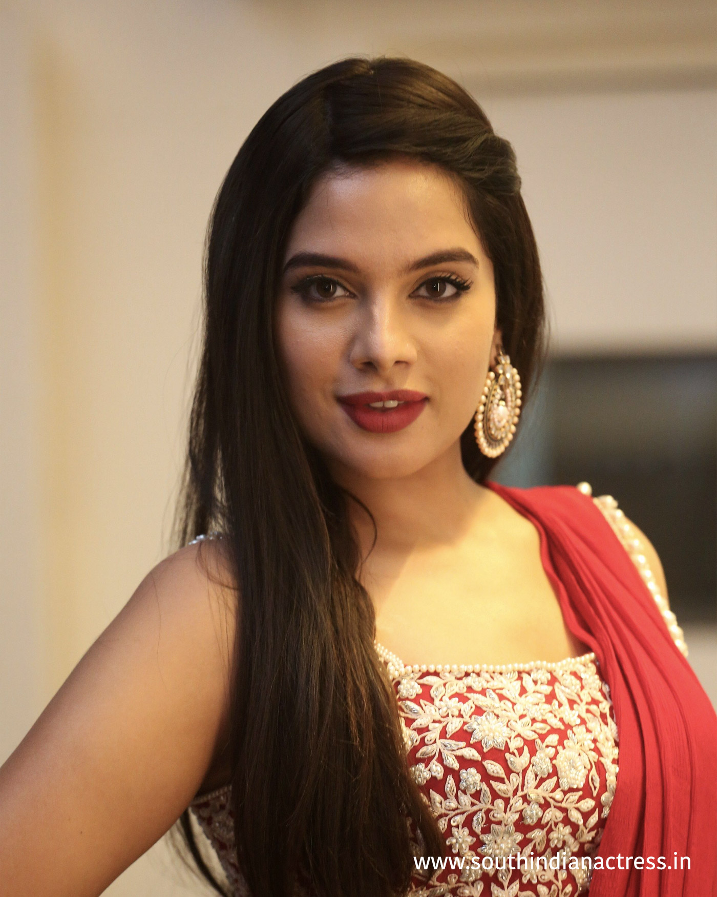 Tanya Hope red saree stills at Disco Raja Pre-Release event