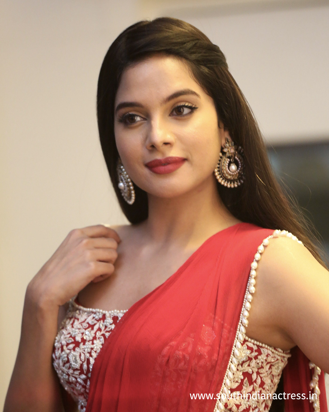 Tanya Hope red saree stills at Disco Raja Pre-Release event