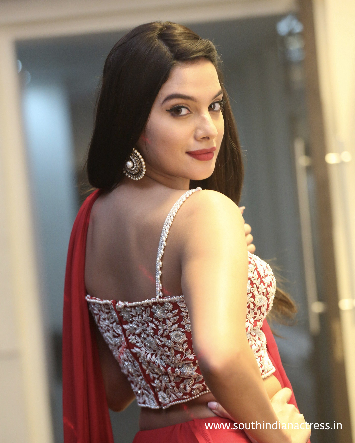 Tanya Hope red saree stills at Disco Raja Pre-Release event