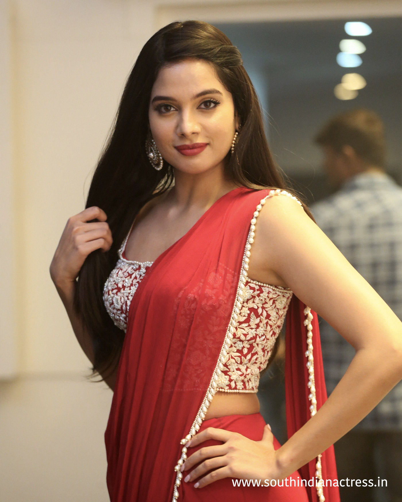 Tanya Hope red saree stills at Disco Raja Pre-Release event