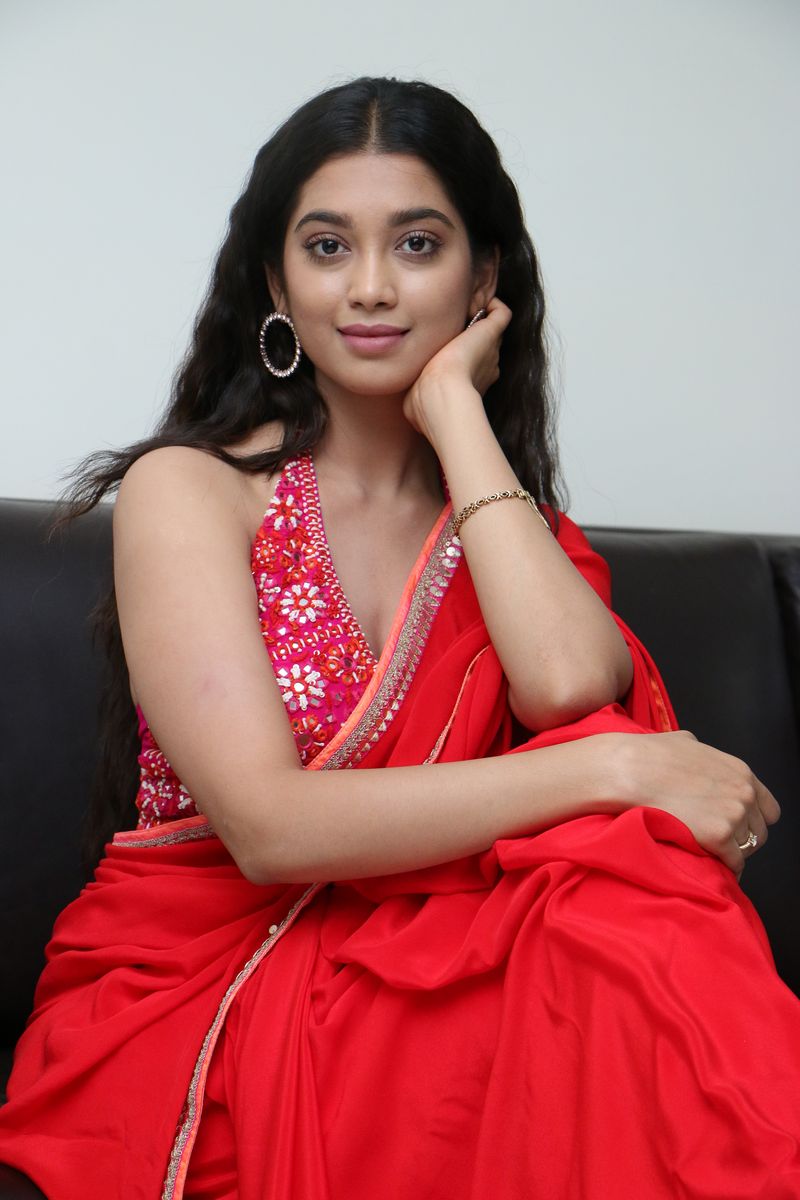 Digangana Suryavanshi in red saree at Valayam movie interview