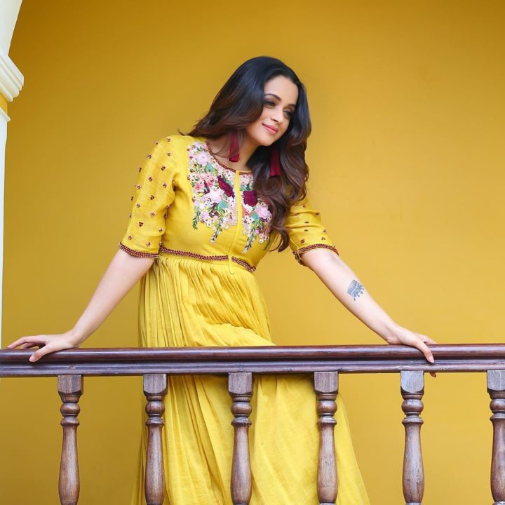 Bhavana beautiful stills in yellow outfit