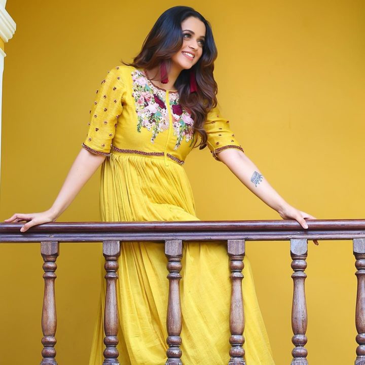 Bhavana beautiful stills in yellow outfit