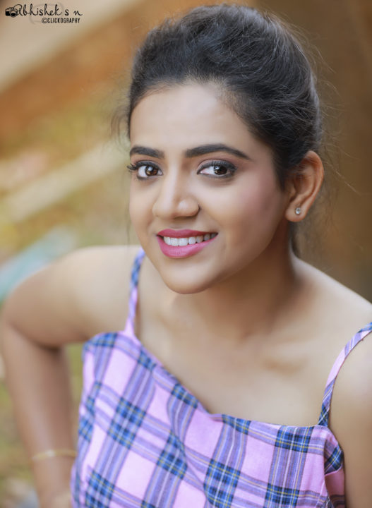 Harshitha Gowda hot stills in pink Playsuit