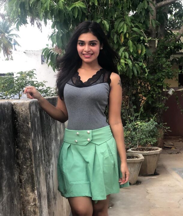 Dharsha Gupta in green short skirt sills