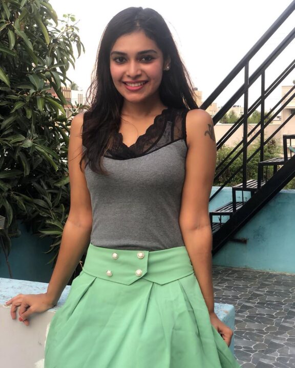 Dharsha Gupta in green short skirt sills