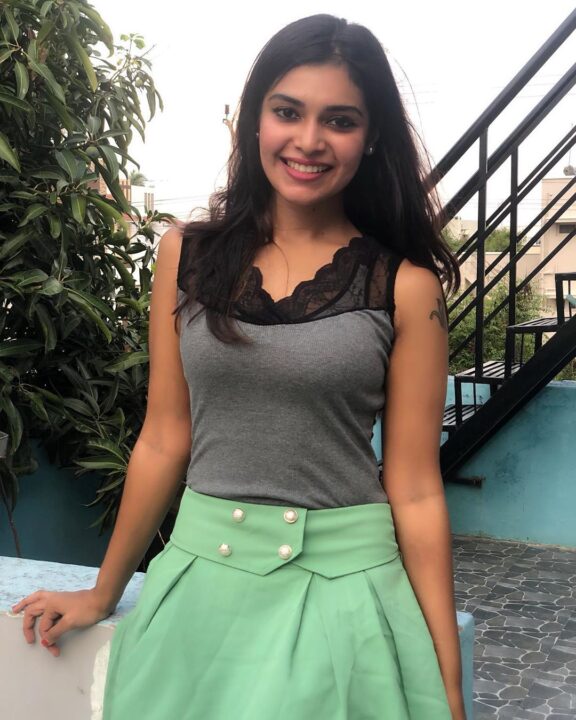 Dharsha Gupta in green short skirt sills