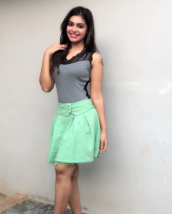 Dharsha Gupta in green short skirt sills