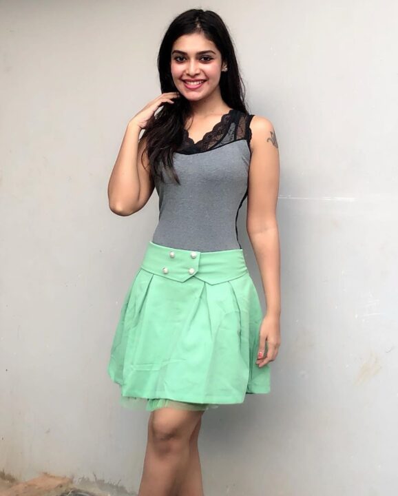 Dharsha Gupta in green short skirt sills