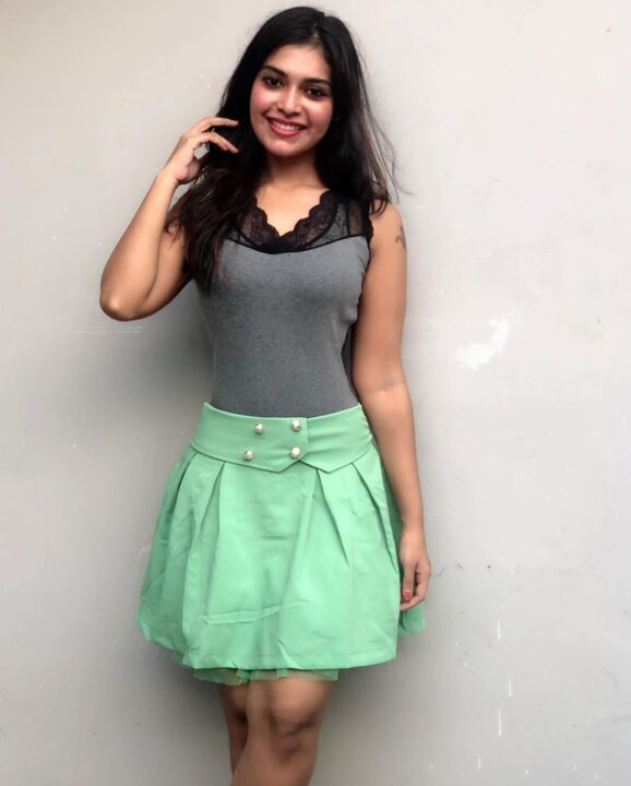 Dharsha Gupta in green short skirt sills