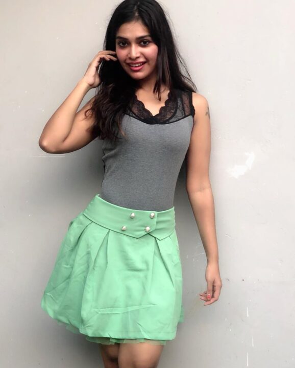 Dharsha Gupta in green short skirt sills