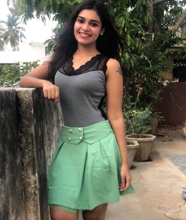 Dharsha Gupta in green short skirt sills