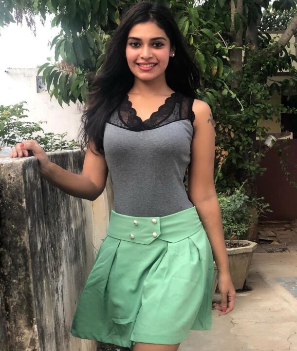 Dharsha Gupta in green short skirt sills