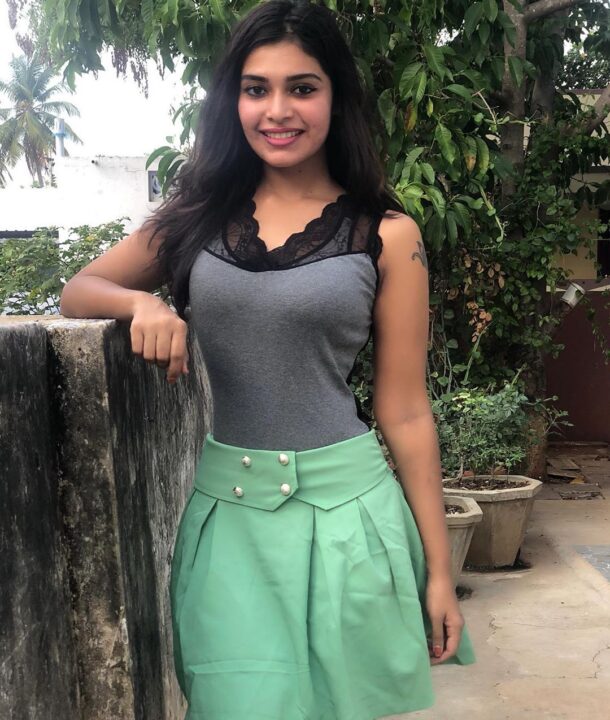 Dharsha Gupta in green short skirt sills