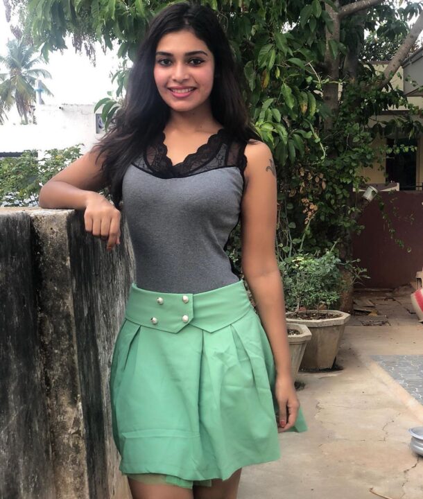 Dharsha Gupta in green short skirt sills