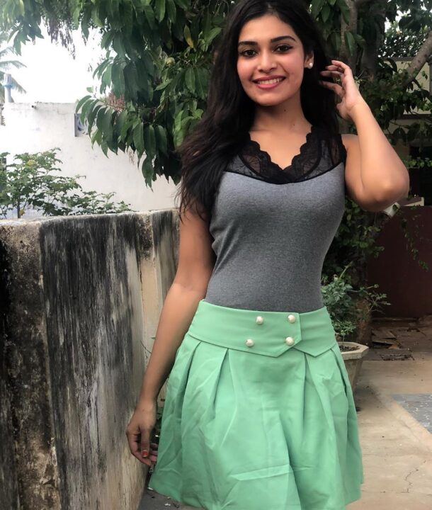 Dharsha Gupta in green short skirt sills