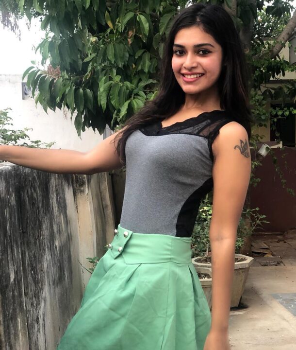 Dharsha Gupta in green short skirt sills