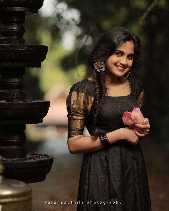 Devika Sanjay stills in black traditional Kerala dress