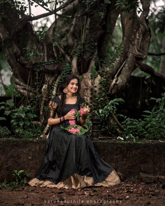 Devika Sanjay stills in black traditional Kerala dress