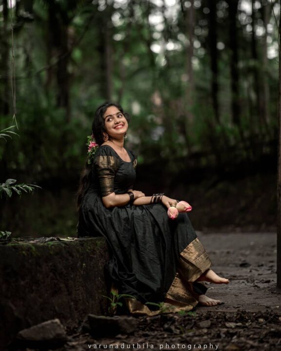 Devika Sanjay stills in black traditional Kerala dress