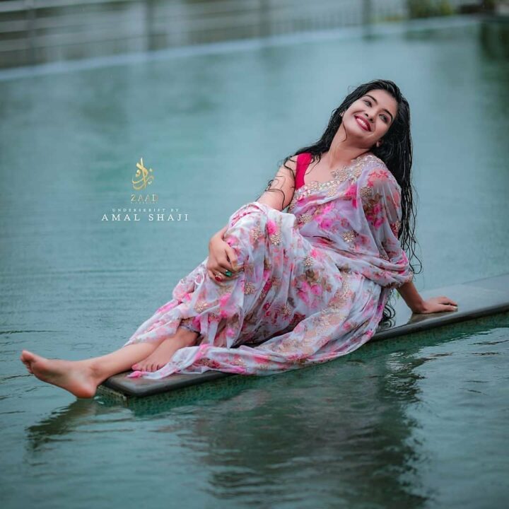 Malayalam actress Monisha Arshak saree stills in rain