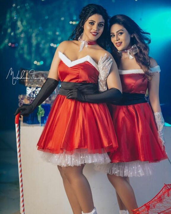 Ineya and her sister Swathi in Christmas outfit photos