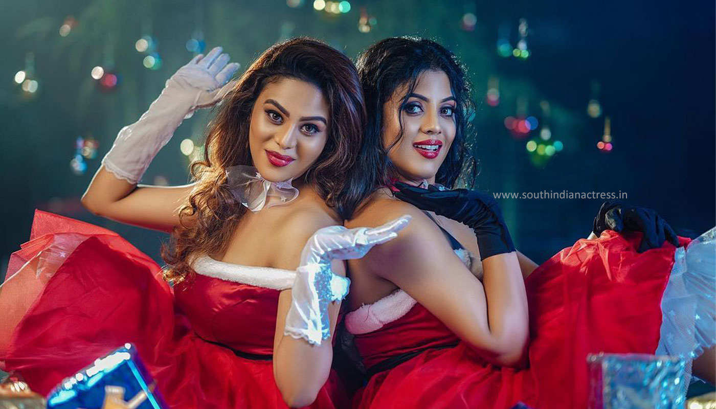 Ineya and her sister Swathi in Christmas outfit photos