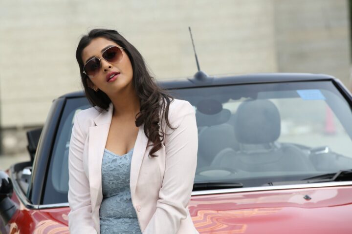 Pooja Jhaveri hot stills on her Mini Cooper car