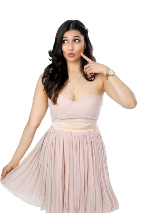 Mannara Chopra photoshoot stills in peach colour dress