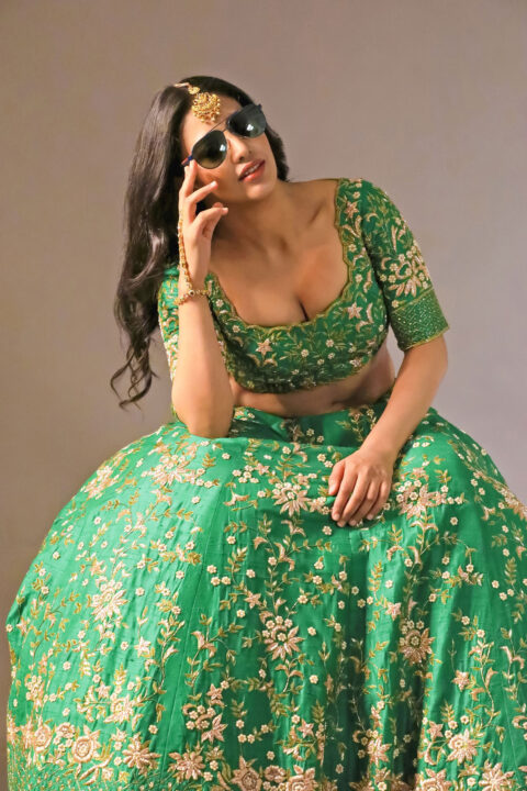 Daksha Nagarkar hot cleavage stills in green lehenga