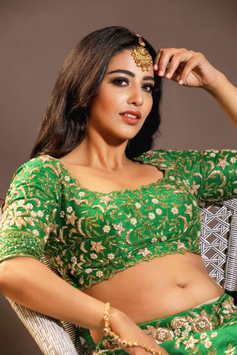 Daksha Nagarkar hot navel stills in green lehenga