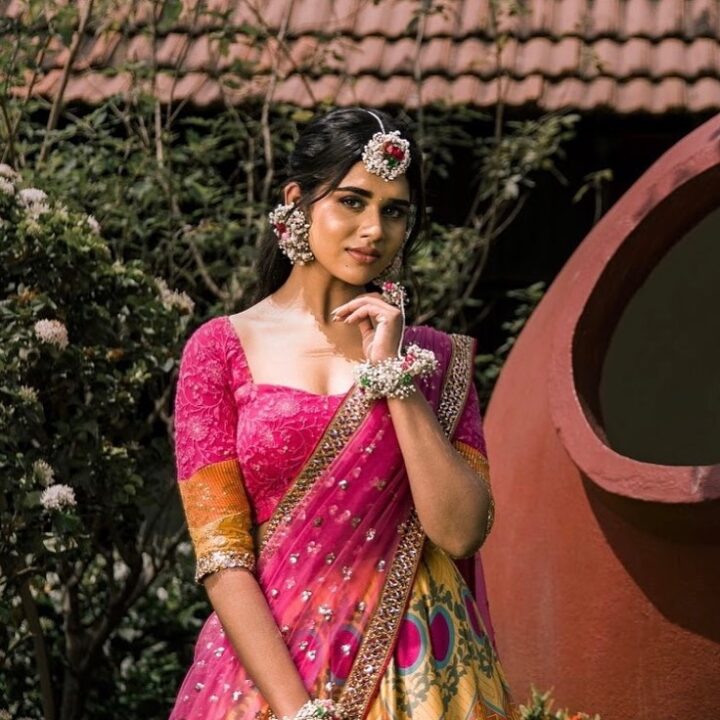 Meenakshi Govindharajan in pink Mehendi function lehenga