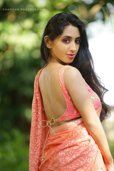 Nisarga Lakshman Gowda hot navel stills in pink saree