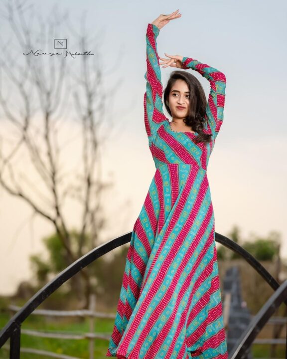 Deepthi Sunaina in long sleeve maxi dress photos