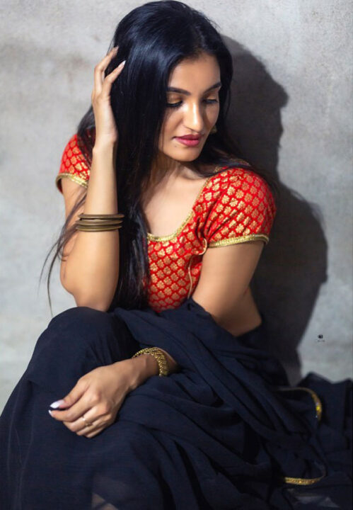 Sonia Naresh in black saree hot photoshoot stills