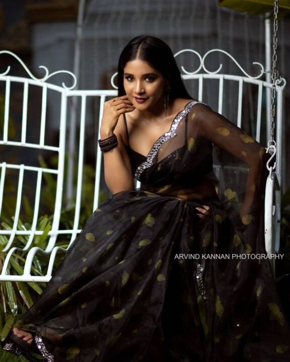 Sakshi Agarwal hot cleavage stills in black organza saree