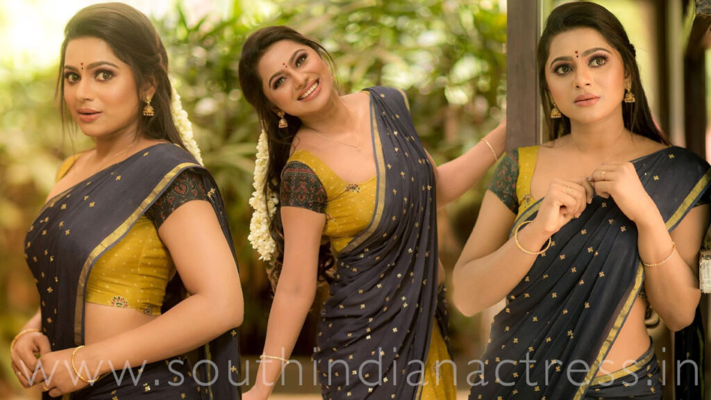 Delna Davis in Megendi Yellow half saree photos