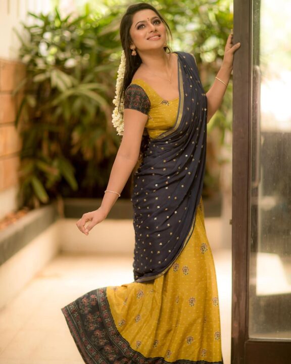 Delna Davis in Megendi Yellow half saree photos