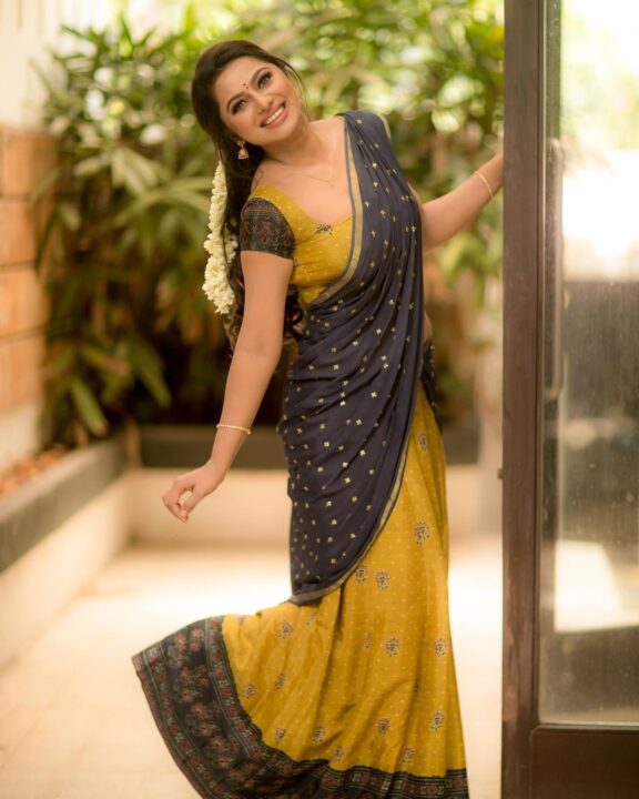 Delna Davis in Megendi Yellow half saree photos