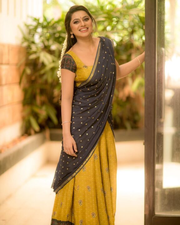 Delna Davis in Megendi Yellow half saree photos