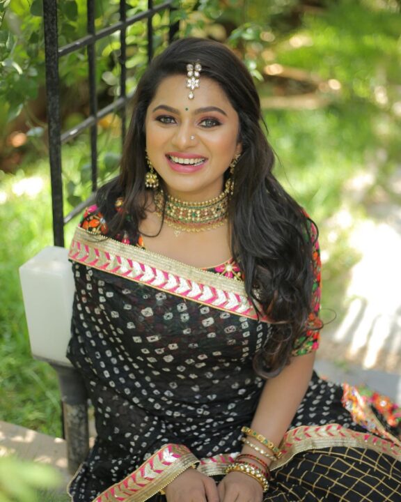 Delna Davis in black half saree photos