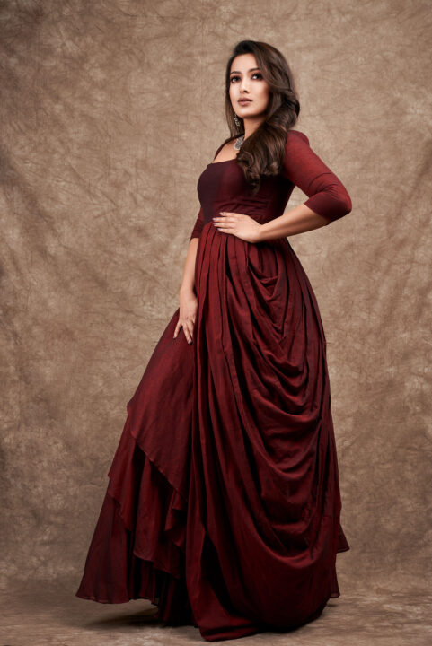 Catherine Tresa in maroon gown dress