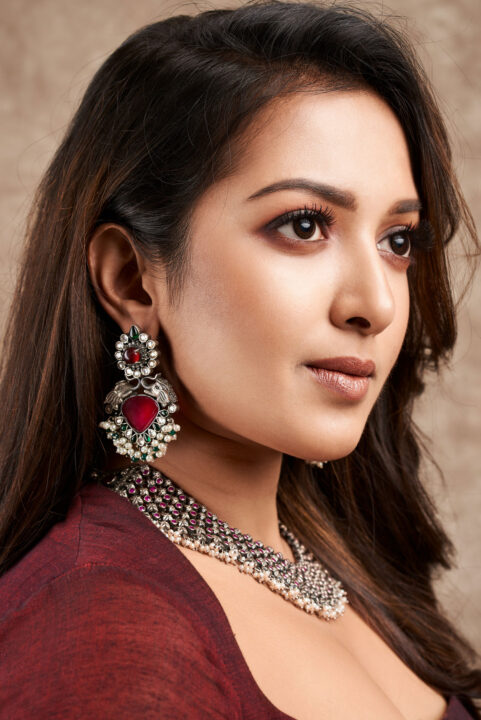 Catherine Tresa in maroon gown dress