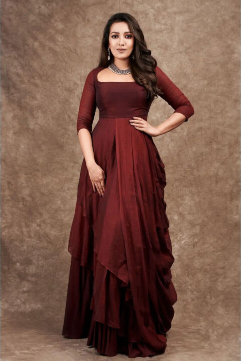 Catherine Tresa in maroon gown dress