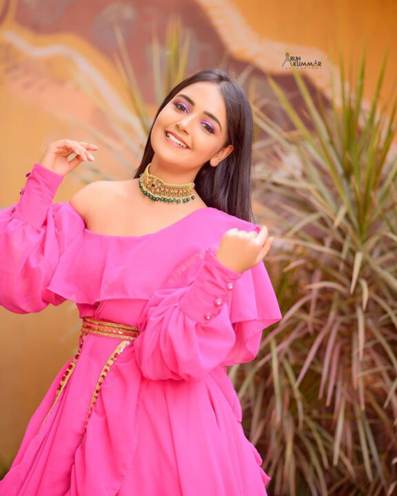 Nisha Ravikrishnan in pink dress photoshoot stills