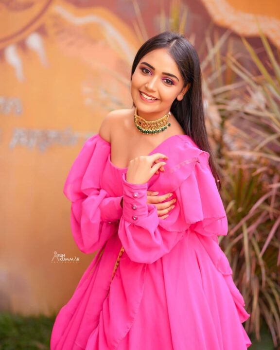 Nisha Ravikrishnan in pink dress photoshoot stills